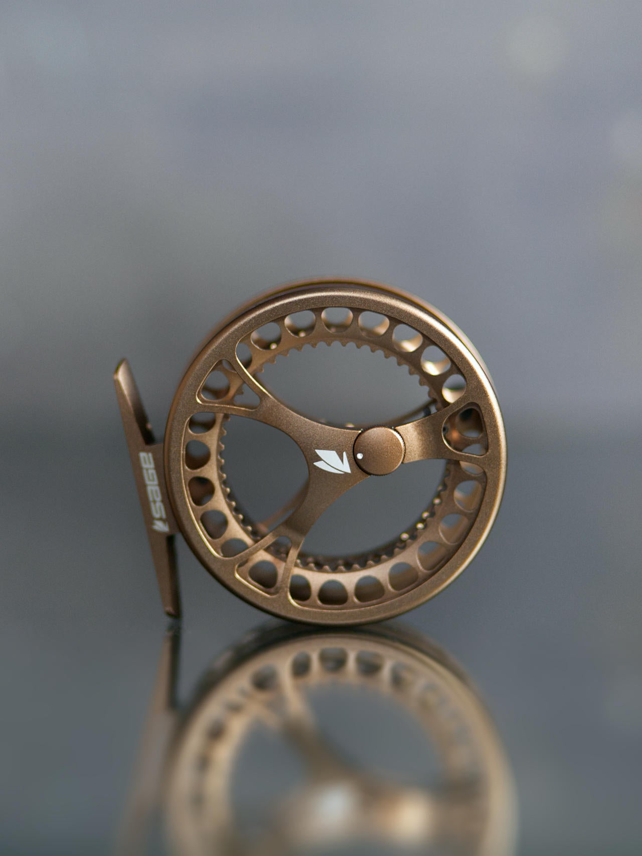 Sage Click Fliegenrolle mit Click-Pawl Bremssystem Gold